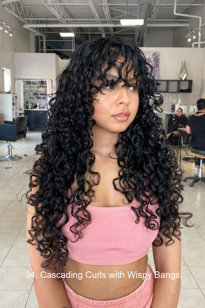 34. Cascading Curls with Wispy Bangs